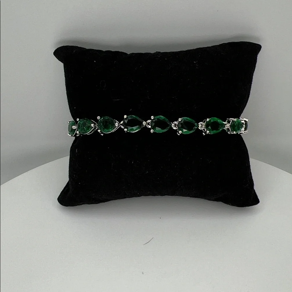 198. White Gold Plated Bracelet with Pear Shaped Emeralds 7”